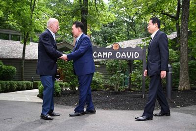 Biden says ‘world is safer’ as he meets with Japanese and South Korean leaders at Camp David