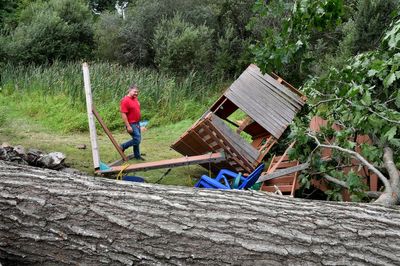 Rhode Island tornado lifts car as New England storms damages homes, flood roads