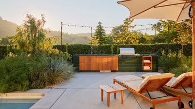 This tiled outdoor "kitchen island" was designed to blend in, but it's the stand-out of this Californian backyard