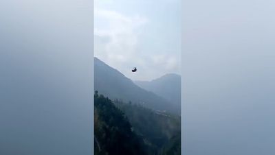 All seven children and teacher rescued from cable car dangling 900ft above Pakistan ravine