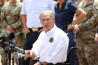 Greg Abbott branded ‘evil’ for sending migrant bus to LA in middle of tropical storm Hilary