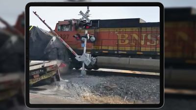 Video: Train Crashes, Derails After Hitting Semi-Truck Stuck On Crossing