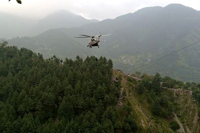 Eight rescued from dangling cable car in Pakistan after day-long ordeal