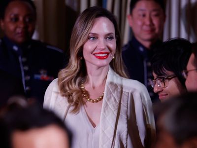 Fans speculate what Angelina Jolie’s new middle finger tattoos may be