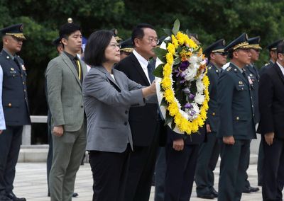 Taiwan's president renews her pledge to stronger self defense during visit to war memorial
