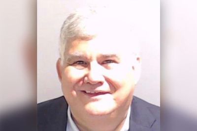 Trump codefendant posts smiling mugshot after surrendering to Fulton County Jail: ‘New profile picture’