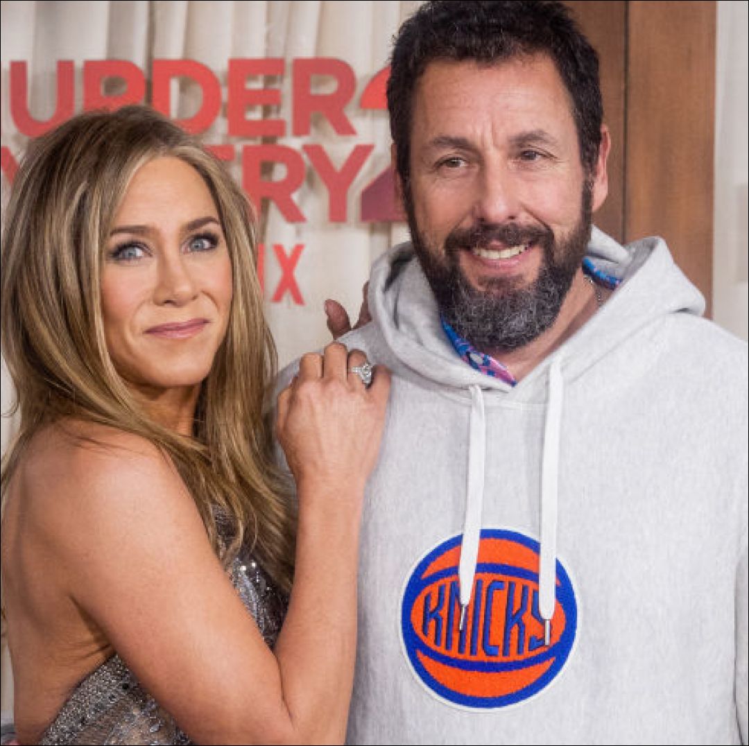 Jennifer Aniston Says Adam Sandler Sends Her Flowers…