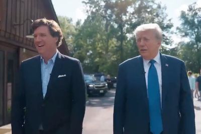 Trump attacks rivals in online interview with Tucker Carlson while skipping presidential debate