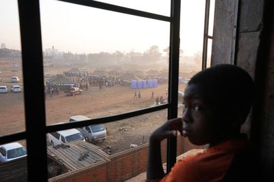 Zimbabwe's election extends to a second day after long ballot delays. Some slept at polling stations