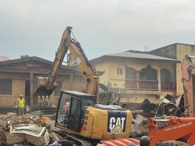 Building collapse in Nigeria's capital leaves two people dead while many are feared trapped