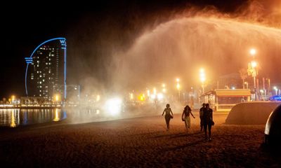 Barcelona gives hats to homeless people as heatwave sweeps southern Europe