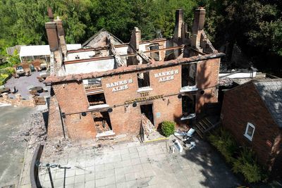 Two men arrested after fire at Crooked House pub