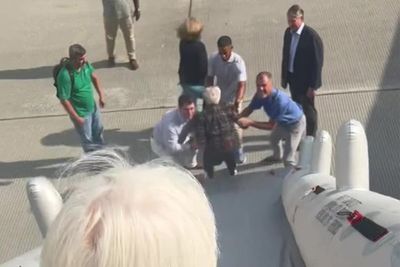 Passenger films herself laughing as she goes down plane’s inflatable evacuation slide