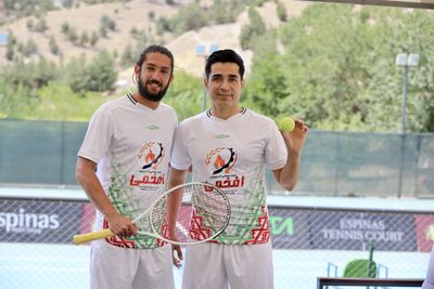 Tennis and football star band together in Iran to invent new world record