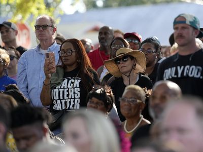 People mourn victims of the Florida shooting as a hate crime investigation begins