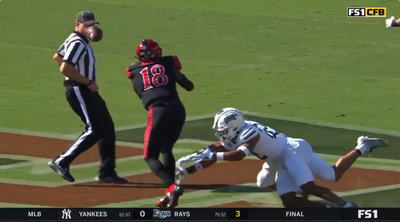 San Diego State’s quarterback accidentally hit a referee in the face with a football while throwing it away