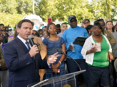 Ron DeSantis is booed by mourners as he attends Jacksonville vigil after racist shooting