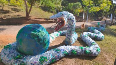 90-foot-long snake about to swallow globe — installation art made out of plastic bottles — draws crowds at Onam display in Kerala