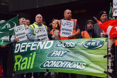 The company operating Britain’s massive railway network is withholding bonuses from as many as 20,000 workers because they went on strike