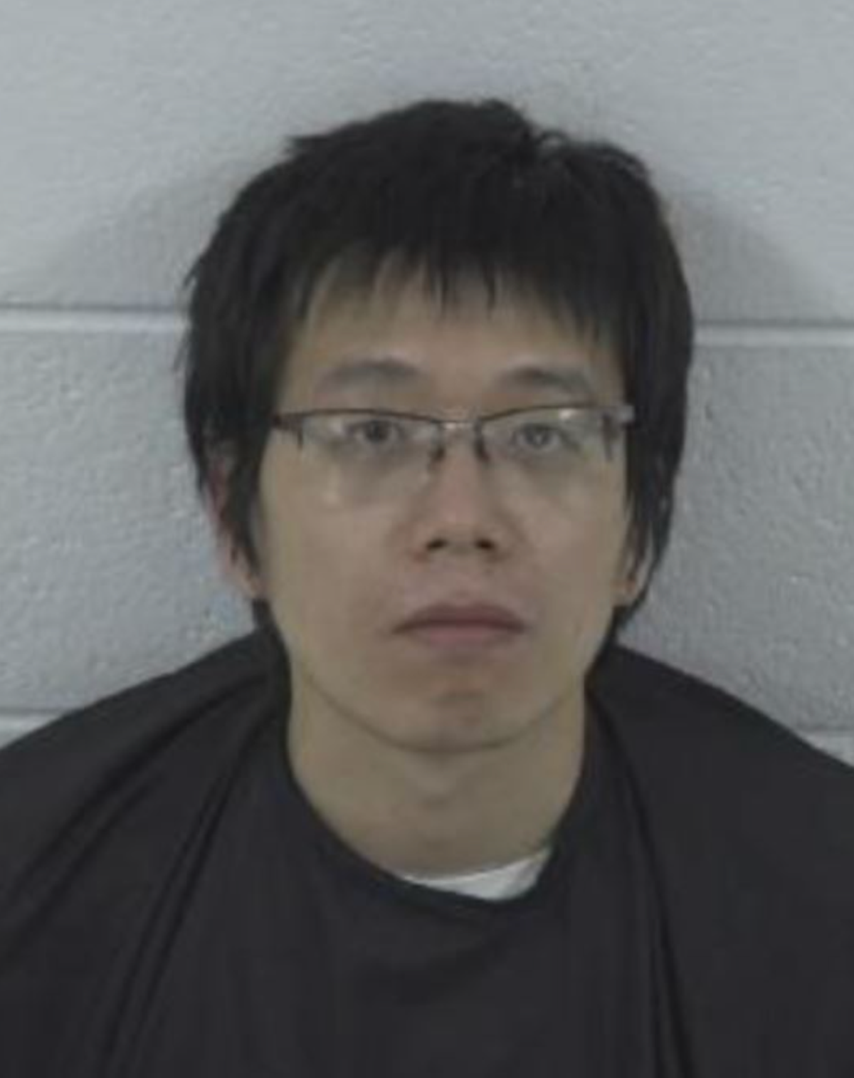 UNC Chapel Hill graduate student Tailei Qi charged…