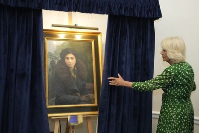 Queen unveils portrait at RAF Club of British resistance agent Noor Inayat Khan