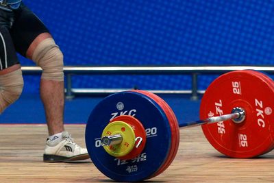 Iran bans weightlifter for life after he shakes Israeli’s hand on podium