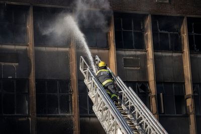 Johannesburg fire kills at least 74, including 12 children, as blaze sweeps derelict building