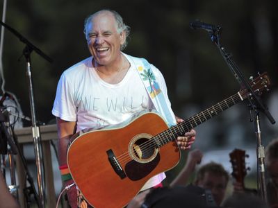 Jimmy Buffett, who sang of wastin' away in 'Margaritaville', dies at 76