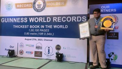 Guinness officials felicitate editor of the thickest book in the world
