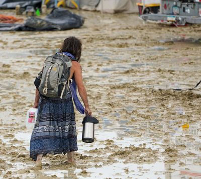 Death at Burning Man investigated in US, thousands stranded by flooding