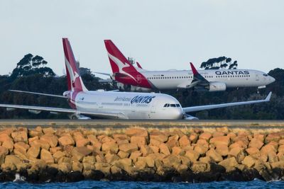 Qantas boss steps down early after scrutiny and legal suit on Australian airline
