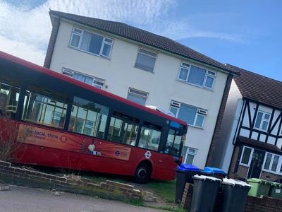 Five injured as London bus crashes into front garden