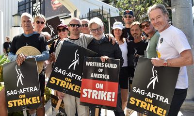 Hollywood's strikes are bulldozing the economy to the tune of 17,000 jobs and forcing a major studio to cut earnings guidance by $500 million.