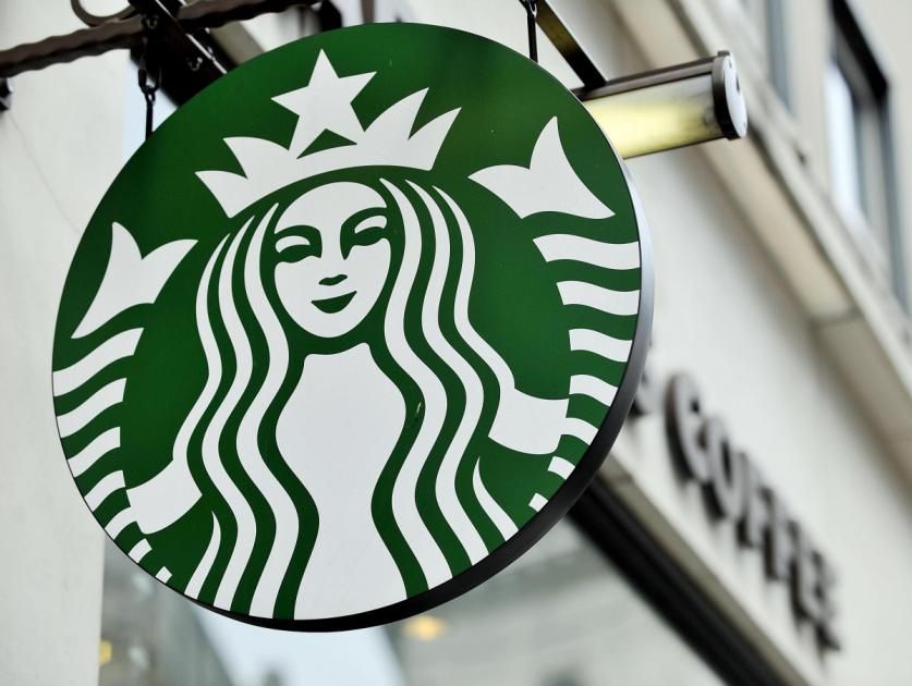 Starbucks cheers good progress in plan to open 100 
