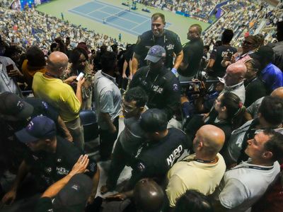 A climate protester glued his feet to floor and interrupted the U.S. Open semifinal