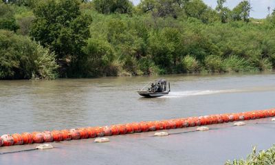 Texas ordered to remove buoys meant to block migrants from Rio Grande River