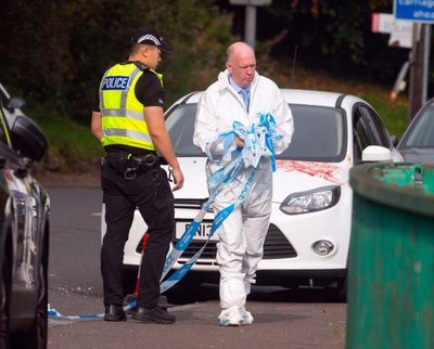 Police confirm woman taken to hospital after passers-by see blood-smeared car