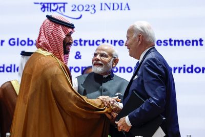 Biden gives Saudi Crown Prince Mohammed a hearty handshake a year after an awkward fist bump moment