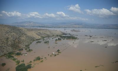 Greek rescuers work through night to locate villagers trapped by flood