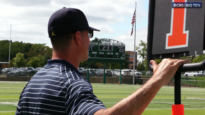 Jim Harbaugh worked the chain crew at his son’s football game during self-imposed suspension from Michigan