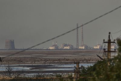 UN atomic watchdog warns of threat to nuclear safety as fighting spikes near a plant in Ukraine