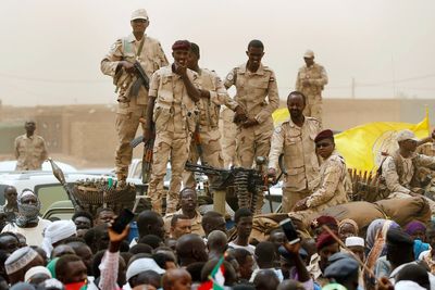 A drone attack kills at least 23 in Sudan’s capital as rival troops battle, activists say