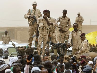 Dozens die from a drone attack on an open market in Sudan as rival troops battle
