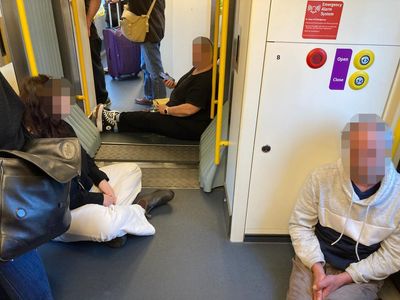 ‘Find a spot on the floor’: overcrowding complaints grow as Victorians take advantage of rail fare cap
