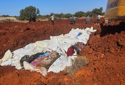 Hundreds buried in mass graves as Libya reels from devastating flooding