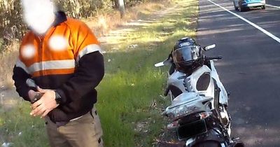 Motorbike rider accused of speeding along road shoulder in heavy traffic