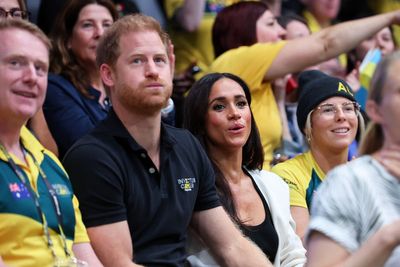 Fans gush over sweet moment woman realises Prince Harry is offering to take her photo with Meghan