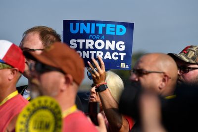 About 13,000 workers go on strike seeking better wages and benefits from Detroit’s three automakers