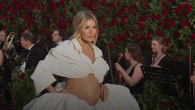 Sienna Miller debuts baby bump in Schiaparelli Couture at Vogue World