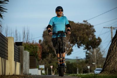 ‘Bottom of the food chain’: e-scooter riders push for reimagining of Australia’s bike lanes